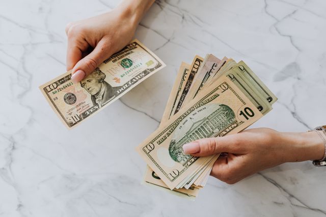 A Portsmouth property owner counting out cash